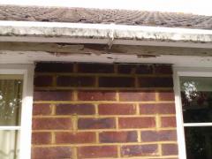 Old boards and guttering to Roofline